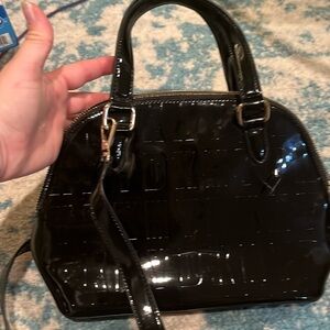 DKNY small hang shoulder bag in patent black with brand name embossed design